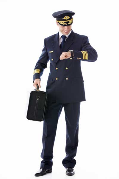 airline pilot checking wristwatch