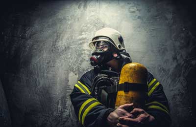 firefighter with oxygen tank