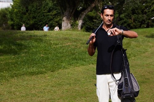 Golfer checking his watch