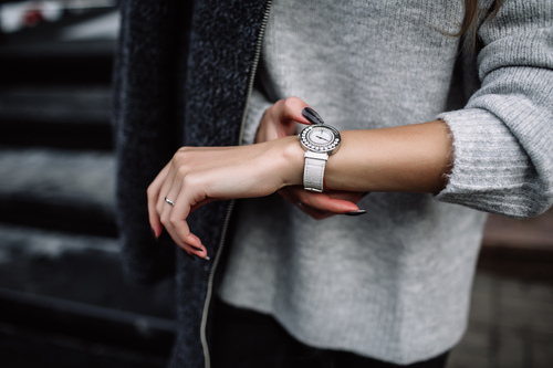 women checking watch