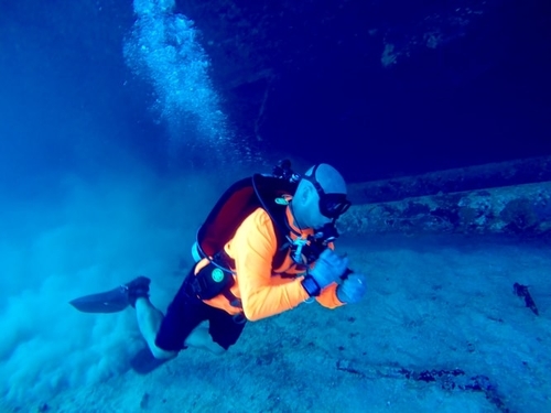 Diver exploring around a wreck