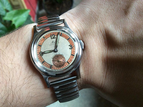 Man wearing Mido watch