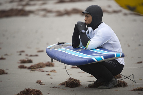 Surfer wearing surfing watch