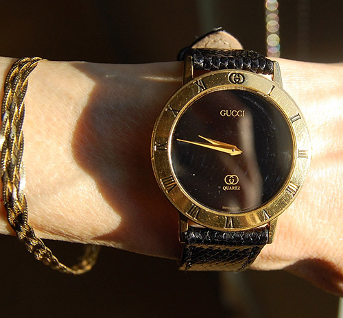 Wearing Gucci watch