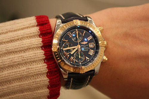 A man wearing Breitling watch