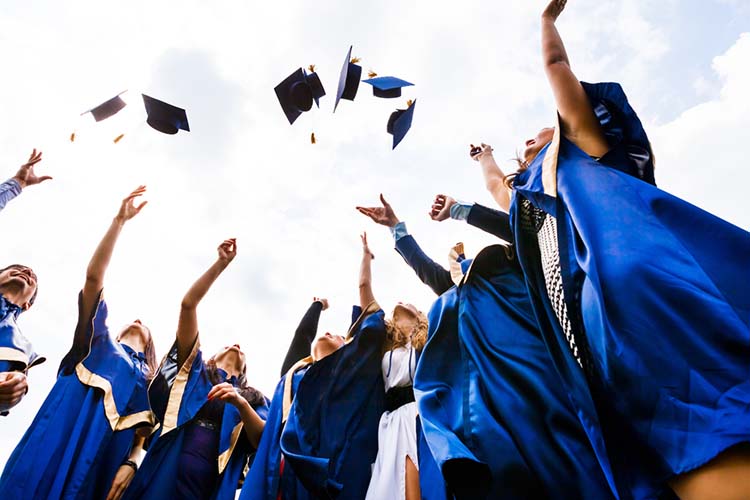 Group of happy young graduates