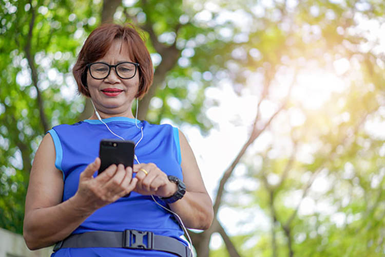 senior enjoying smartwatch and smartphone