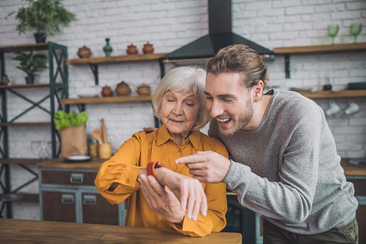 Elderly with son using the smartwatch