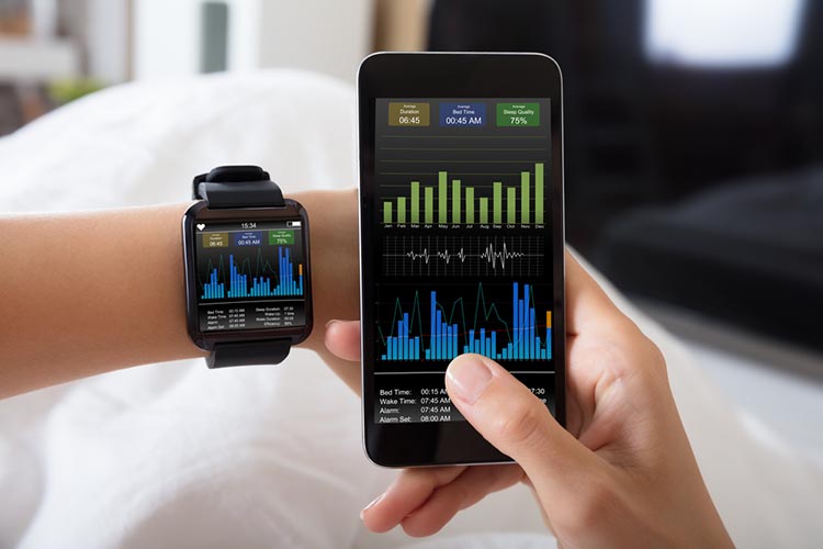 Close-up Of A Female's Hand With Smart Watch And Mobile Phone 