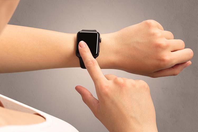 Female hand with black screen smartwatch.