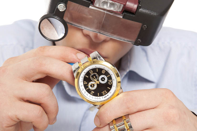 Watchmaker. Watch repair craftsman repairing watch